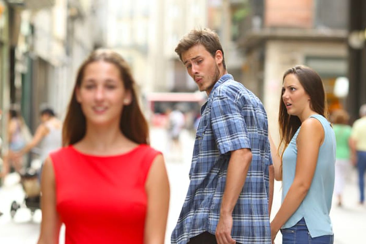 Distracted Boyfriend meme about The Oodie