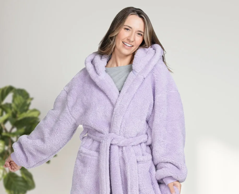 Woman in a lilac fluffy hooded dressing gown